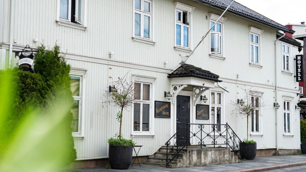 White wooden house facade of a hotel